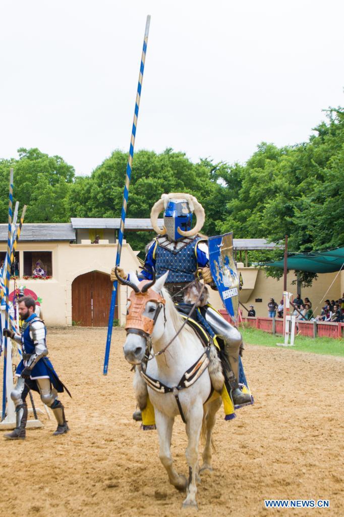 A knight performs jousting at the Scarborough Renaissance Festival on the outskirts of Dallas, Texas, the United States on May 30, 2021. (Photo by Dan Tian/Xinhua)