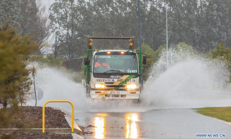 A vehicle runs on a flooded road in Christchurch, New Zealand, May 31, 2021.Photo: Xinhua