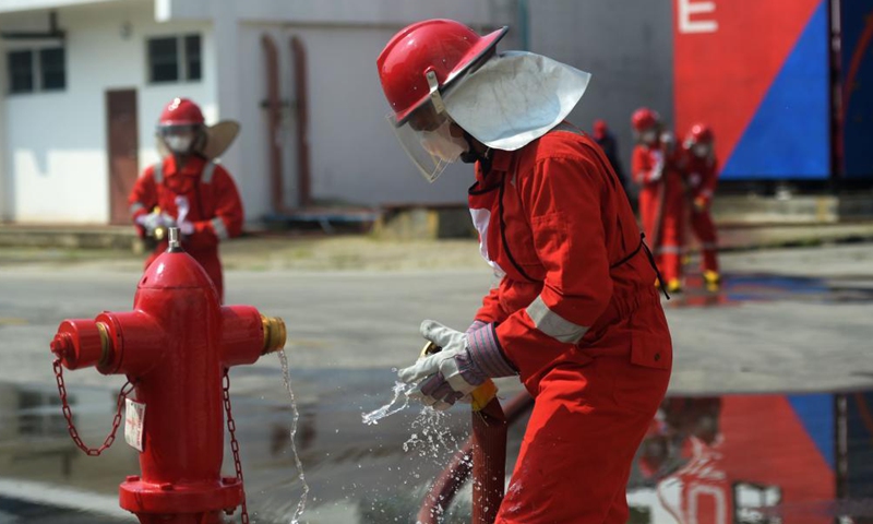 Firefighters compete during the Fire Safety Challenge 2021 competition at Jakarta's firefighter headquarters in Jakarta, Indonesia, June 2, 2021. (Xinhua/Zulkarnain)