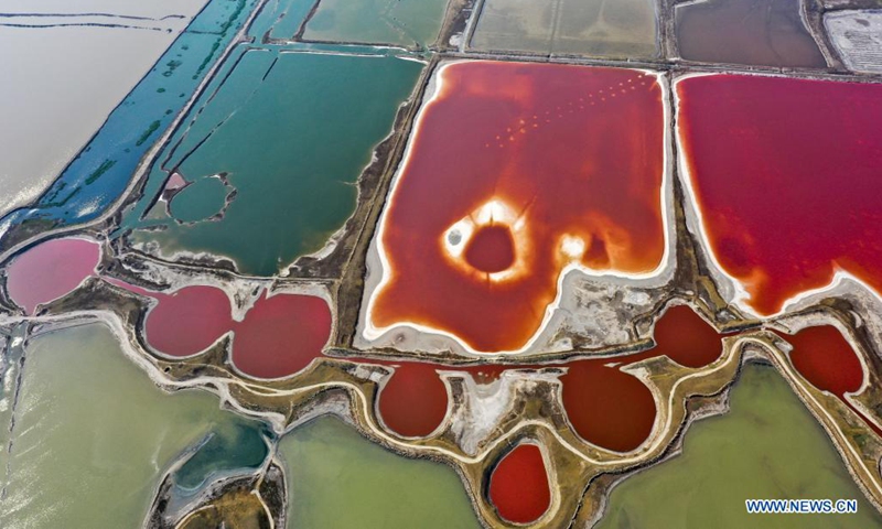 Aerial photo taken on June 1, 2021 shows a view of the salt lake in Yuncheng City, north China's Shanxi Province. Yuncheng Salt Lake, known as the Dead Sea of China, has transformed from a salt production base to a photographers' paradise for its vibrant colors. (Xinhua/Cao Yang)