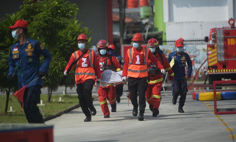 Firefighters compete during the Fire Safety Challenge 2021 competition at Jakarta's firefighter headquarters in Jakarta, Indonesia, June 2, 2021. (Xinhua/Zulkarnain)