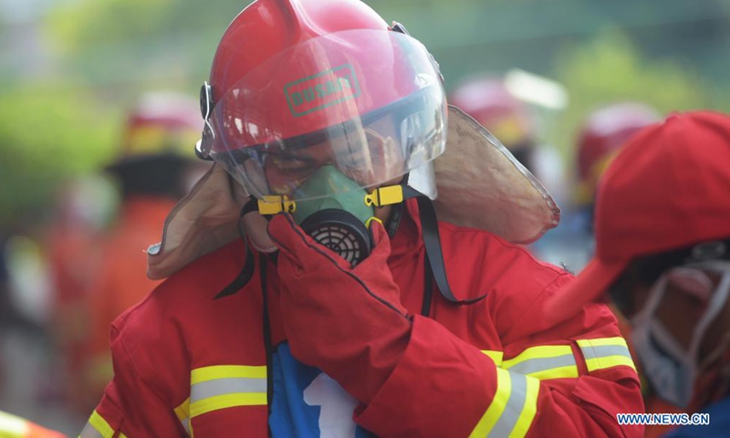 Firefighters compete during the Fire Safety Challenge 2021 competition at Jakarta's firefighter headquarters in Jakarta, Indonesia, June 2, 2021. (Xinhua/Zulkarnain)