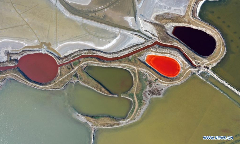 Aerial photo taken on June 1, 2021 shows a view of the salt lake in Yuncheng City, north China's Shanxi Province. Yuncheng Salt Lake, known as the Dead Sea of China, has transformed from a salt production base to a photographers' paradise for its vibrant colors. (Xinhua/Cao Yang)