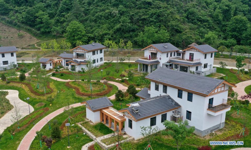 Aerial photo taken on May 21, 2021 shows a cluster of homestays in Zhujiagou Village of Kangxian County, Longnan City, northwest China's Gansu Province. (Xinhua/Chen Bin)