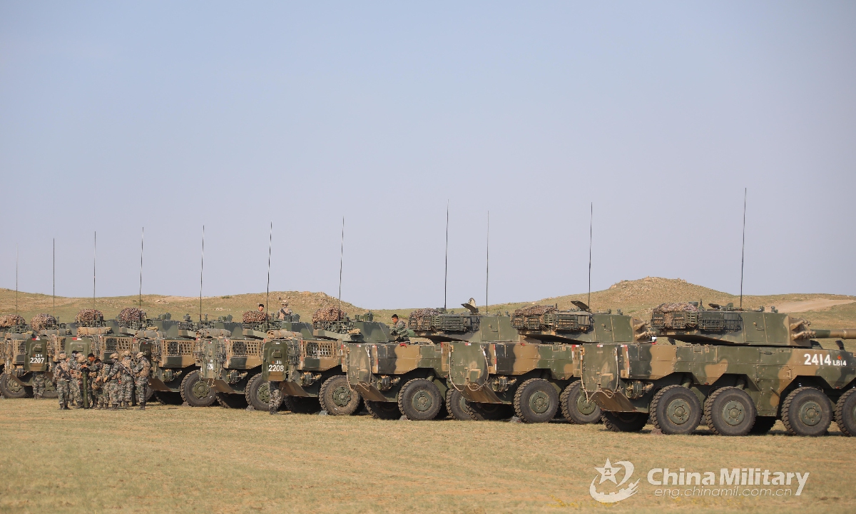 Soldiers assigned to a combined arms brigade under the PLA 78th Group Army check the armored vehicles and are fully armed for the upcoming tactical training in early June, 2021. Photo:China Military