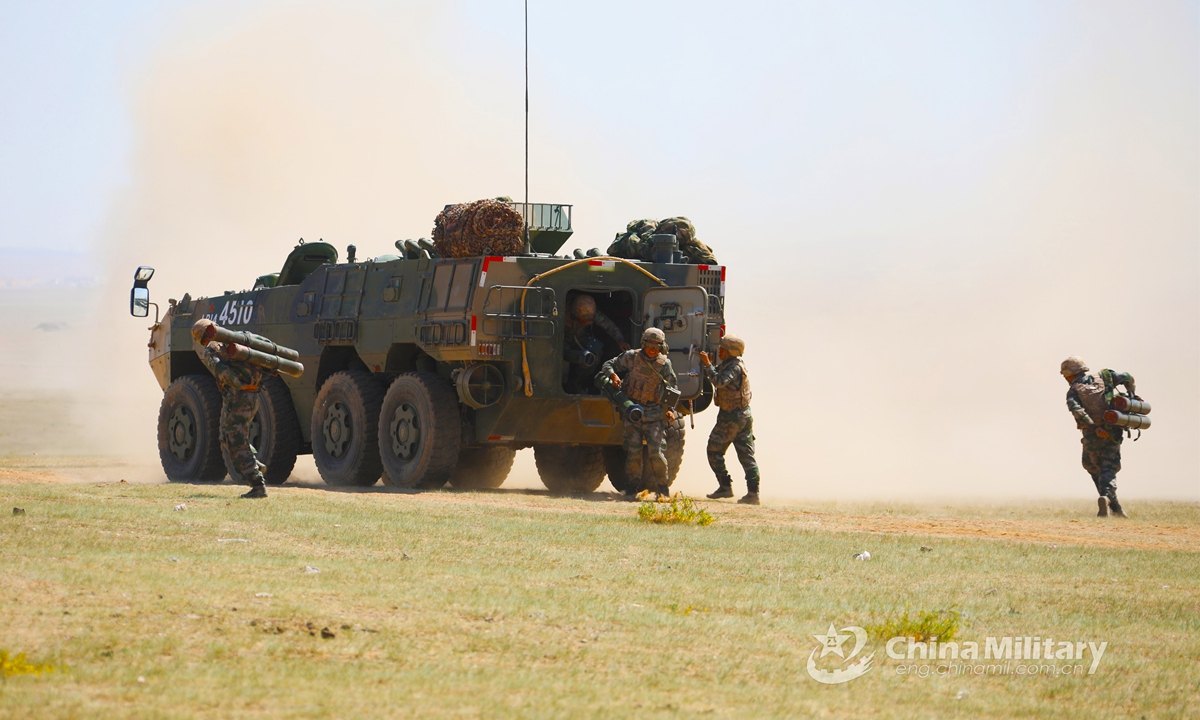 Soldiers assigned to a combined arms brigade under the PLA 78th Group Army quickly jump out of an armored vehicle and keep in fighting trim during the tactical training in early June, 2021.Photo:China Military