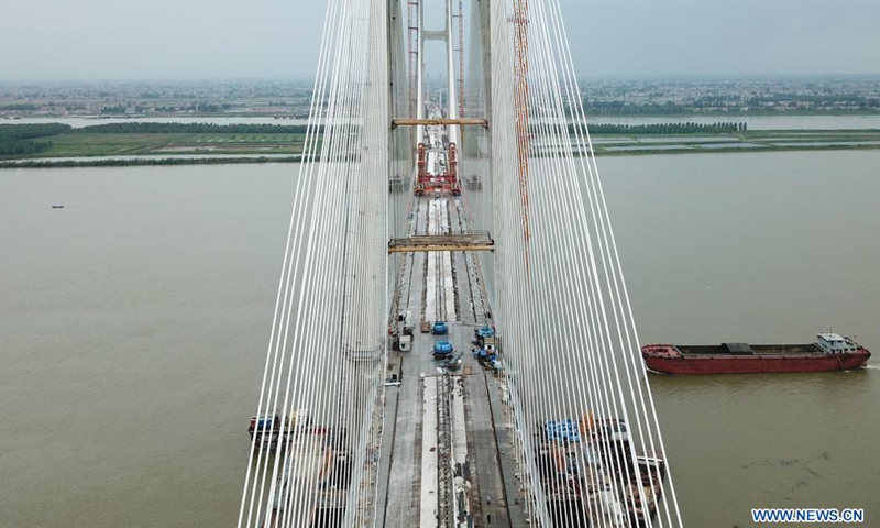 Aerial photo taken on June 3, 2021 shows the Bianyuzhou Yangtze River Bridge on the border of central China's Hubei Province and east China's Jiangxi Province. Connecting Huangmei County of central China's Hubei Province and Jiujiang City of east China's Jiangxi Province, the bridge is part of Anqing-Jiujiang Railway.Photo:Xinhua