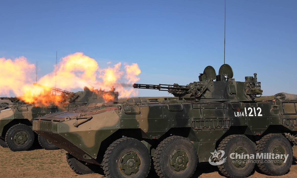 The infantry fighting vehicles (IFVs) attached to a combined arms brigade under the PLA 78th Group Army fire at mock targets during the tactical training in early June, 2021. Photo:China Military