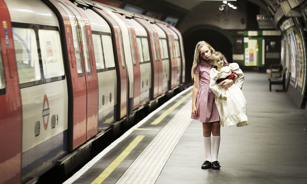 The possessed doll Annabelle, known from The <em>Conjuring</em> universe, accompanied by actress Emilia Sofia Varslauskaite Photo: IC