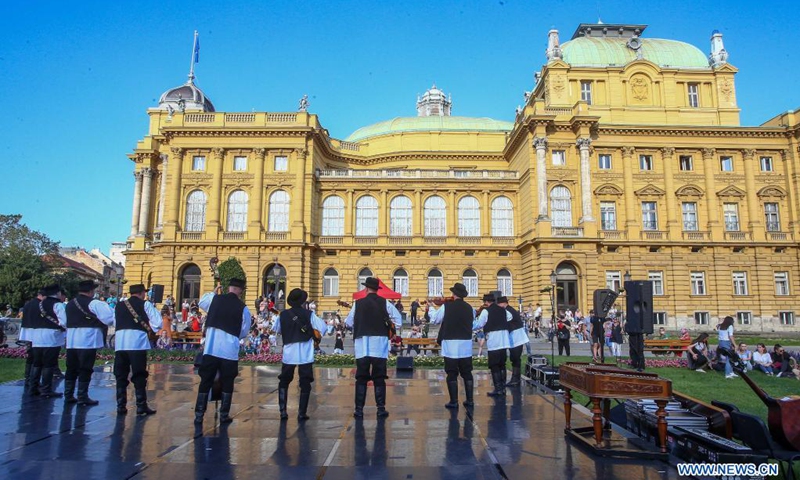 Members of the National Folk Dance Ensemble of Croatia LADO perform on the outdoor summer stage of Croatian National Theater in Zagreb, Croatia, June 16, 2021.(Photo: Xinhua)