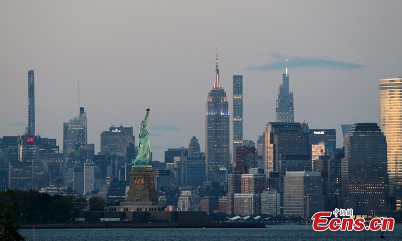 Landmark buildings such as the Empire State Building lit blue and gold lights on June 15. (Photo/ Liao Pan)
