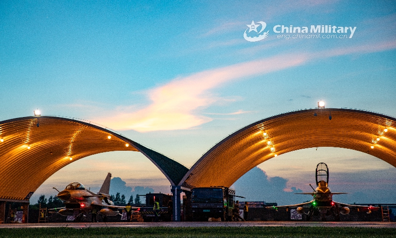 Fighter jets attached to an aviation brigade of the air force under the PLA Southern Theater Command receive pre-flight inspections in aircraft hangars prior to a round-the-clock flight training exercise on June 16, 2021. (Photo: eng.chinamil.com.cn)