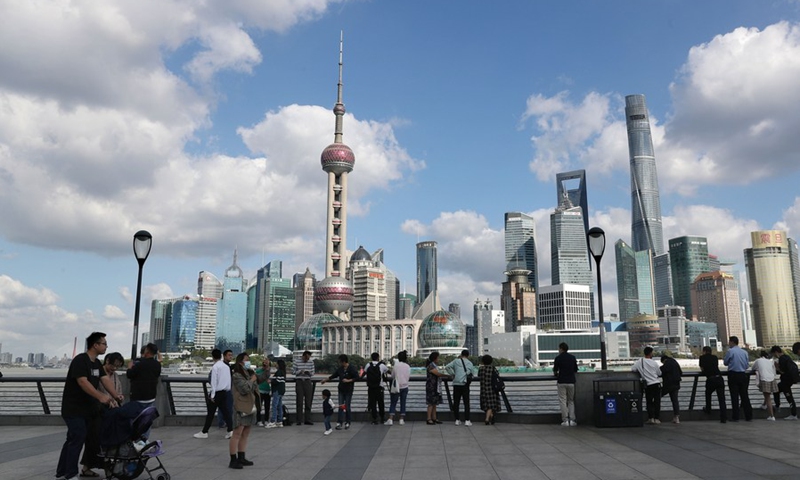 People visit the Bund in east China's Shanghai, Oct. 8, 2020.(Photo: Xinhua)