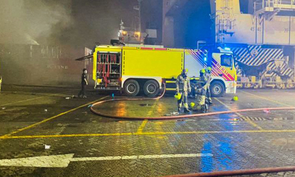 This handout picture provided by the Government of Dubai Media Office on July 8, 2021, shows civil defence firefighters at the scene of a blaze that broke out at Dubai's main port of Jebel Ali following an explosion. Photo: VCG