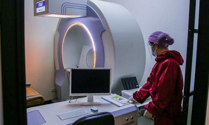 A medical staff member prepares health management unit inside the Health Care medical clinic in Mandaluyong City, the Philippines, July 7, 2021.(Photo: Xinhua)