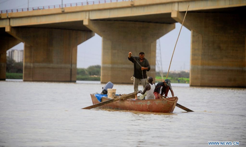 People fish in the Nile during the rainy season in Khartoum, Sudan, on July 25, 2021.(Photo: Xinhua)