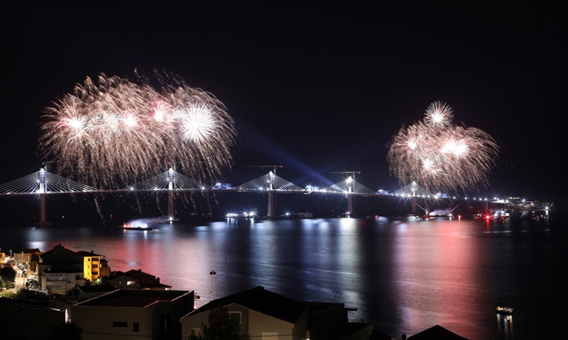 Photo taken on July 29, 2021 shows fireworks celebrating the successful connection of the Peljesac Bridge at Mali Ston Bay near Komarna of southern Croatia.Photo:Xinhua