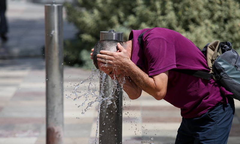 A man cools off in fountains at Skanderbeg Square in the center of capital Tirana, Albania, July 29, 2021.Photo:Xinhua