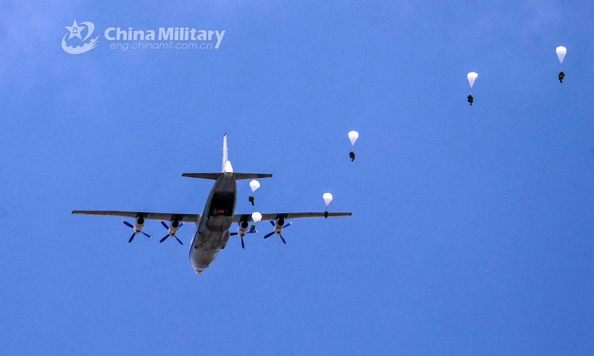 Paratroopers assigned to a brigade under the PLA Air Force’s airborne troops descend to the drop zone after jumping from a transport aircraft during a parachute training exercise in mid-July, 2021. (eng.chinamil.com.cn/Photo by Liu Huan)