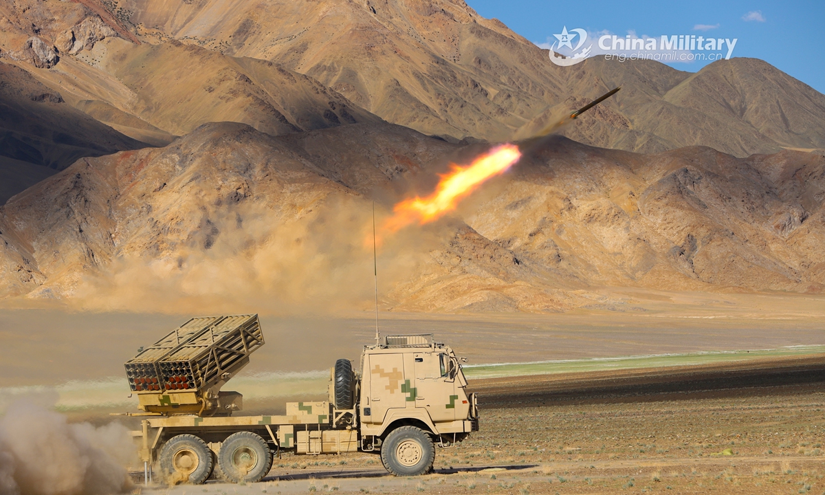 A truck-mounted long-range multiple launch rocket system (LRMLRS) attached to an artillery detachment with a regiment under the PLA Army fires a rocket against the mock target during a live-fire test in July of 2021. (eng.chinamil.com.cn/Photo by Xiang Xudong)