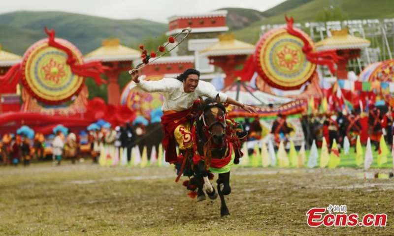 A local resident performs horse racing during a celebration marking the 70th anniversary of the founding of Yushu Tibetan Autonomous Prefecture in northwest China's Qinghai Province, Aug. 4, 2021. (Photo: China News Service/Ma Mingyan) 

The performance told the story of Yushu's development through melodrama, singing and dancing.
