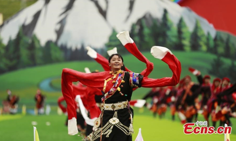 Local residents perform traditional Tibetan dance during a celebration marking the 70th anniversary of the founding of Yushu Tibetan Autonomous Prefecture in northwest China's Qinghai Province, Aug. 4, 2021. (Photo: China News Service/Ma Mingyan)
