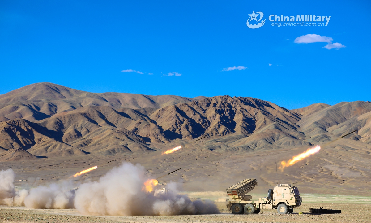 Truck-mounted long-range multiple launch rocket systems (LRMLRS) attached to an artillery detachment with a regiment under the PLA Army fire rockets at mock ground targets during a live-fire test in July of 2021. (eng.chinamil.com.cn/Photo by Xiang Xudong)