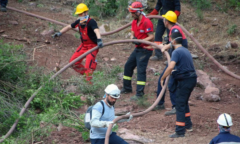 Firefighters battle a wildfire in Marmaris, Mugla province, southwestern Turkey, on Aug. 5, 2021. Turkey has been battling massive wildfires that had erupted in southern and southwestern coastal resort towns for over one week. The blazes have claimed eight lives.Photo:Xinhua