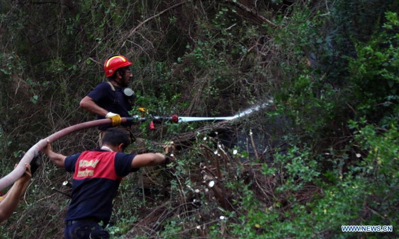 Firefighters battle a wildfire in Marmaris, Mugla province, southwestern Turkey, on Aug. 5, 2021. Turkey has been battling massive wildfires that had erupted in southern and southwestern coastal resort towns for over one week. The blazes have claimed eight lives.Photo:Xinhua