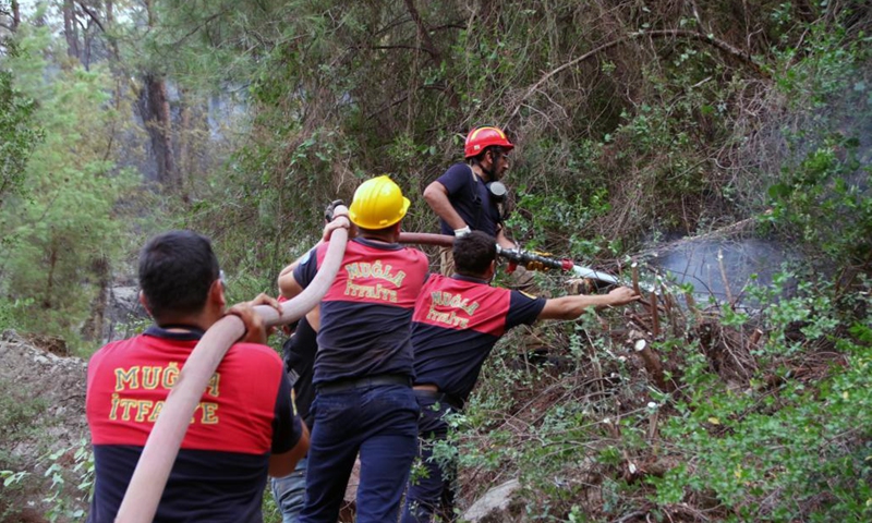 Firefighters battle a wildfire in Marmaris, Mugla province, southwestern Turkey, on Aug. 5, 2021. Turkey has been battling massive wildfires that had erupted in southern and southwestern coastal resort towns for over one week. The blazes have claimed eight lives.Photo:Xinhua