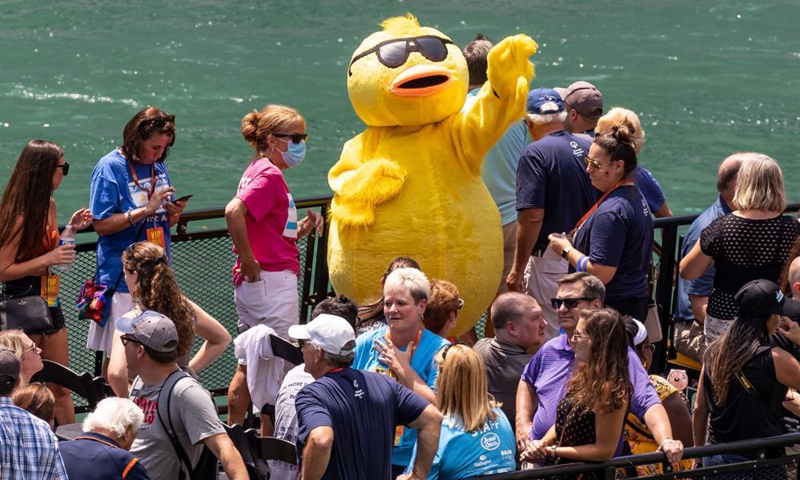 The mascot of the 2021 Chicago Ducky Derby waves from the official boat in downtown Chicago, the United States, on Aug. 5, 2021.Photo:Xinhua