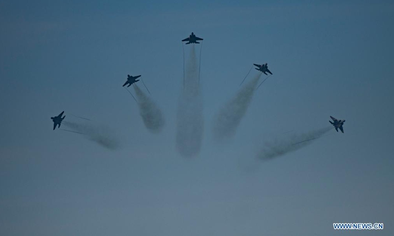 A fleet of fighter planes flies in formation during the National Day celebrations in Singapore, Aug. 9, 2021. Singapore celebrated the 56th anniversary of independence on Monday. (Xinhua/Then Chih Wey)