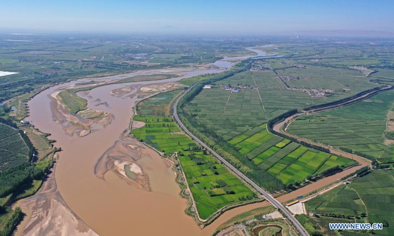 Aerial photo taken on Aug. 5, 2021 shows the Wuzhong Yellow River bridge which connects Qingtongxia City with Litong District of Wuzhong City in northwest China's Ningxia Hui Autonomous Region. (Xinhua/Wang Peng)