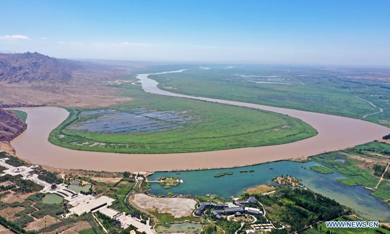 Aerial photo taken on Aug. 5, 2021 shows the scene of a turning of the Yellow River in Qingtongxia City, northwest China's Ningxia Hui Autonomous Region. (Xinhua/Wang Peng)

