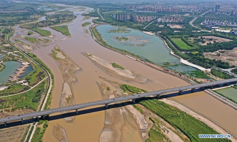 Aerial photo taken on Aug. 5, 2021 shows the Wuzhong Yellow River bridge which connects Qingtongxia City with Litong District of Wuzhong City in northwest China's Ningxia Hui Autonomous Region. (Xinhua/Wang Peng)