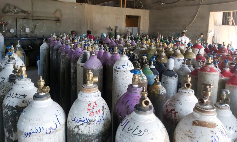 Oxygen cylinders are seen at a medical oxygen plant in Tajura, Libya, on Aug. 8, 2021. The Libyan Ministry of Health has provided oxygen supplies to some hospitals in the capital Tripoli. Major hospitals in the city recently suffered from a severe lack of oxygen, as the country continues to record new COVID-19 cases.(Photo: Xinhua)