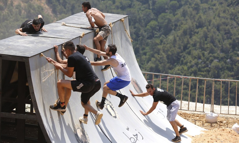 Competitors take part in the Hannibal Race 2021 in Broummana, Lebanon, on Aug. 8, 2021.(Photo: Xinhua)