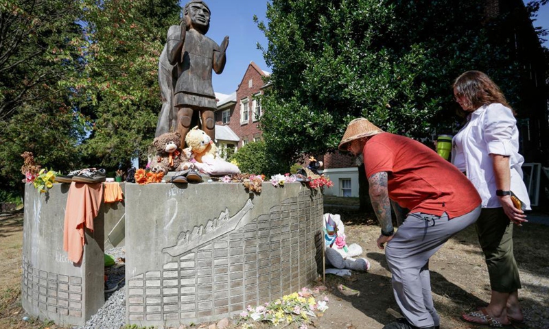 People visit a memorial at the site of the former St. Paul Indian Residential School in North Vancouver, British Columbia, Canada, on Aug. 10, 2021. Three British Columbia First Nations said they will work together to investigate the disappearance of indigenous children at the site of the former St. Paul's Indian Residential School in North Vancouver on Tuesday. (Phhoto: Xinhua)