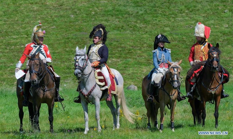 Riders take part in a cavalry competition on the site of Battle of Waterloo, in Braine-l'Alleud, Belgium, Aug. 14, 2021. A cavalry competition named Memorial Trophy was organized by the Waterloo 1815 Memorial on the site of Battle of Waterloo on Saturday and Sunday. During the competition, some 30 riders will compete in several events like orienteering race, cavalry charge demonstrations, saber exercises while riding the horse, etc. (Xinhua/Zhang Cheng)
