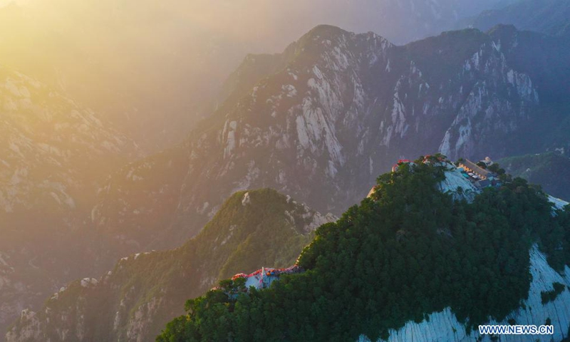 Aerial photo taken on Aug. 15, 2021 shows the Mount Huashan at dawn in Weinan City, northwest China's Shaanxi Province. (Xinhua/Tao Ming)