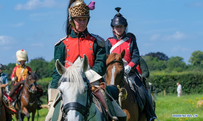 Riders take part in a cavalry competition on the site of Battle of Waterloo, in Braine-l'Alleud, Belgium, Aug. 14, 2021. A cavalry competition named Memorial Trophy was organized by the Waterloo 1815 Memorial on the site of Battle of Waterloo on Saturday and Sunday. During the competition, some 30 riders will compete in several events like orienteering race, cavalry charge demonstrations, saber exercises while riding the horse, etc. (Xinhua/Zhang Cheng)
