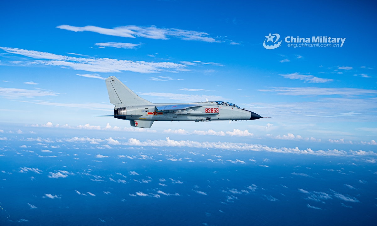 A fighter bomber attached to a naval aviation brigade under the PLA Northern Theater Command pierces into the stratosphere through clouds and mist during a round-the-clock flight training exercise in late July. (eng.chinamil.com.cn/Photo by Li Mingxi and Liu Xuhong)