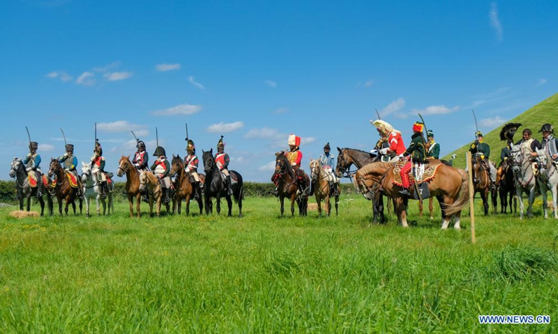 Riders take part in a cavalry competition on the site of Battle of Waterloo, in Braine-l'Alleud, Belgium, Aug. 14, 2021. A cavalry competition named Memorial Trophy was organized by the Waterloo 1815 Memorial on the site of Battle of Waterloo on Saturday and Sunday. During the competition, some 30 riders will compete in several events like orienteering race, cavalry charge demonstrations, saber exercises while riding the horse, etc. (Xinhua/Zhang Cheng)
