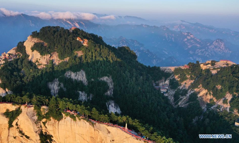 Aerial photo taken on Aug. 15, 2021 shows the Mount Huashan at dawn in Weinan City, northwest China's Shaanxi Province. (Xinhua/Tao Ming)