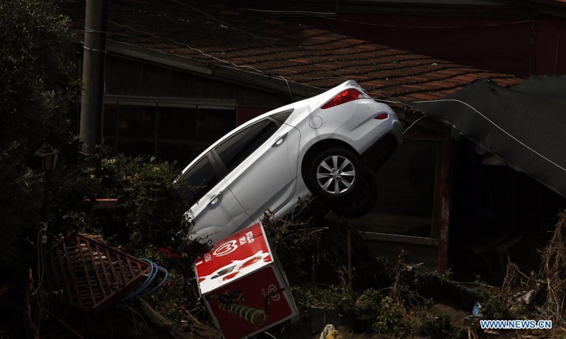 Photo taken on Aug. 16, 2021 shows a damaged car in the flood-hit area in the town of Abana, Kastamonu province, Turkey. At least 74 people died and 47 others went missing in severe floods and mudslides in the Black Sea region of Turkey, the country's disaster agency said on Monday. Floods caused by heavy rain hit the Black Sea region in the north of the country on Aug. 11, leaving 62 dead in the province of Kastamonu.(Photo: Xinhua)