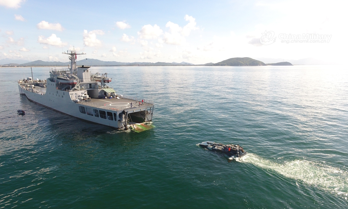 Amphibious armored vehicles attached to a brigade of the PLA Navy Marine Corps practice entering and leaving the well deck of the floating tank landing ship during a maritime training exercise in mid July, 2021. (eng.chinamil.com.cn/Photo by Liu Yuxiang)