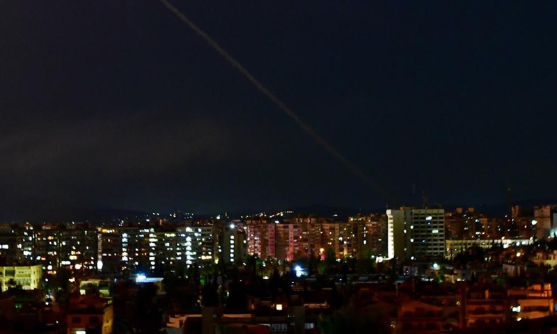 A trail of smoke is seen in the sky over Damascus, Syria, on Aug. 19, 2021. Israel launched missile strikes at some sites in Damascus and the central province of Homs on Thursday night, Syrian state TV reported. Photo:Xinhua