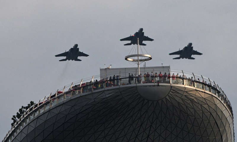 Aircraft fly in formation as part of the aerial performance in Marina Bay during the National Day Parade show held in Singapore on Aug. 21, 2021.(Photo: Xinhua)