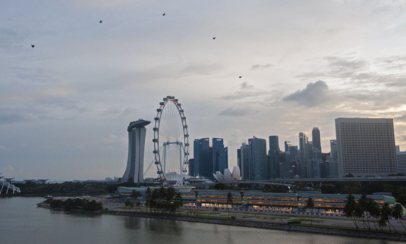 Aircraft fly in formation as part of the aerial performance in Marina Bay during the National Day Parade show held in Singapore on Aug. 21, 2021.(Photo: Xinhua)