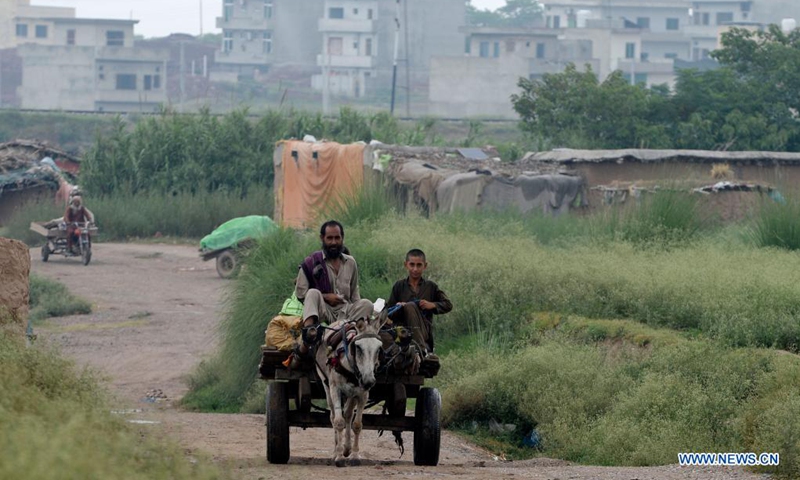 Afghan refugees ride on a donkey-cart on the outskirts of Islamabad, capital of Pakistan, Aug. 22, 2021.Photo: Xinhua